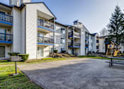 Thumbnail 27 of 35 - 2 BR Apartments in Everett Washington - Woodbrook - BBQ Area with Grill, Picnic Table, and Playground