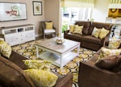 Thumbnail 18 of 23 - clubhouse with seating at Woodlake Villas pet-friendly apartments in Orlando, FL