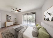 Thumbnail 11 of 17 - a bedroom with a bed and a ceiling fan
