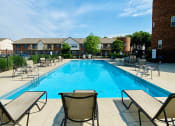 Thumbnail 14 of 17 - lounge chairs by pool at Abbey Court Apartments