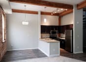 Thumbnail 8 of 22 - an empty kitchen with an island in the middle of it