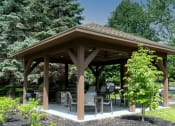 Thumbnail 24 of 33 - covered grill station at Old Farm Shores apartments