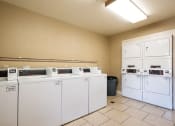 Thumbnail 15 of 29 - Laundry Facility at Mill Creek Apartments