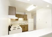 Thumbnail 6 of 13 - Kitchen with Breakfast Bar in Apartment