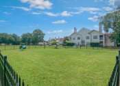 Thumbnail 8 of 13 - fenced in Dog park at Rosewood Apartment's 