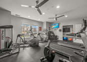 Thumbnail 24 of 30 - On-site fitness center at apartment community