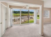 Thumbnail 3 of 15 - Sliding Glass Doors leading to apartment patio