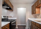 Thumbnail 9 of 29 - Apartment Kitchen with Appliances