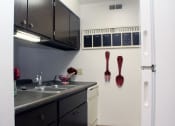 Thumbnail 2 of 22 - Apartment Kitchen with Dishwasher