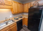 Thumbnail 9 of 23 - all black appliances at Jackson TN apt kitchen