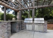Thumbnail 8 of 21 - outdoor grilling at The Oaks at Jackson apartments