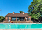 Thumbnail 27 of 32 - pool and clubhouse at apartment community