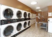 Thumbnail 24 of 28 - Onsite laundry facility at the Gates of Rochester Apartments