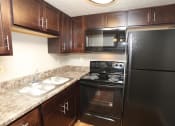 Thumbnail 2 of 18 - apartment kitchen with microwave