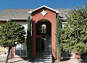 Thumbnail 29 of 32 - A red building with a star on the top of the archway entrance.