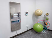 Thumbnail 14 of 20 - a room with a mirror and a ball on the wall