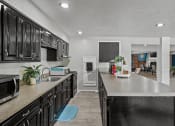 Thumbnail 17 of 27 - clubhouse kitchen with cabinets and a counter top