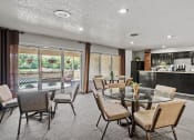 Thumbnail 13 of 27 - a dining room with a glass table and chairs