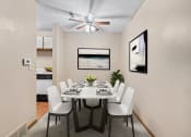 Thumbnail 2 of 28 - a dining room with a table and chairs and a ceiling fan