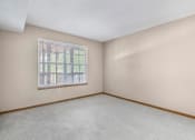 Thumbnail 14 of 28 - an empty bedroom with a large window