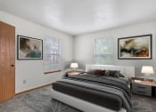 Thumbnail 5 of 28 - a bedroom with a bed and two windows