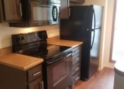 Thumbnail 2 of 9 - Shaker Cabinets and Hardwood-Style Flooring