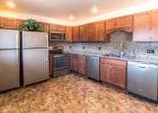 Thumbnail 15 of 30 - Clubhouse kitchen at Fox Hill Glens apartments