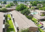 Thumbnail 30 of 32 - A bird's eye view of a residential area with houses, cars, and a pool.