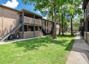 Thumbnail 22 of 25 - open green area outside of apartments at acadian point