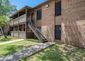 Thumbnail 23 of 25 - Exterior of apartment building at acadian point apartments