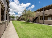 Thumbnail 24 of 25 - apartment building exterior at acadian point apartments