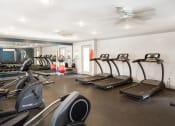 Thumbnail 12 of 25 - spacious fitness center at acadian point apartments