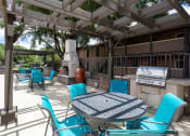 Thumbnail 16 of 25 - lounge area with grilling at acadian point apartments in Lafayatte, LA