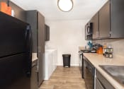 Thumbnail 4 of 25 - Kitchen with storage area at acadian point apartments