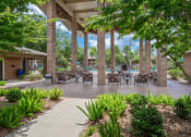 Thumbnail 15 of 25 - beautiful covered lounge space at acadian point apartments