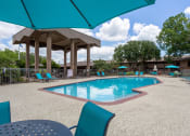 Thumbnail 19 of 25 - beautiful lounge area by pool at acadian point apartments
