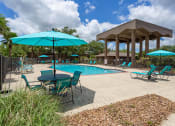 Thumbnail 17 of 25 - Lounge area by resort style swimming pool