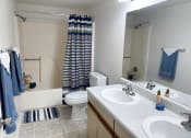 Thumbnail 10 of 19 - a bathroom with a toilet sink and tub