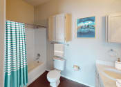Thumbnail 8 of 24 - a bathroom with a toilet sink and bathtub