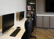 Thumbnail 16 of 24 - a computer desk with two monitors and a keyboard