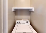 Thumbnail 13 of 24 - a laundry center with a washer and dryer
