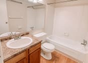 Thumbnail 14 of 27 - apartment bathroom with a bath tub