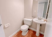 Thumbnail 15 of 27 - an empty bathroom with a toilet and a sink