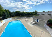 Thumbnail 21 of 32 - Swimming pool at Bloomfield Townhomes in Kentwood MI