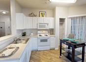 Thumbnail 4 of 32 - apartment kitchen with white cabinets and a sink