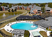 Thumbnail 29 of 32 - aerial view of an outdoor pool and pond