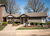 Thumbnail 21 of 23 - A building with a brown roof and a sign that says