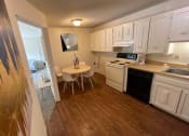 Thumbnail 4 of 8 - apartment kitchen with wood style flooring