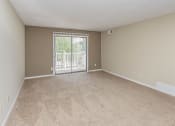 Thumbnail 8 of 29 - Room with carpeting and balcony access at bavarian woods apartments