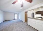 Thumbnail 6 of 29 - Spacious living room by kitchen with overhead light